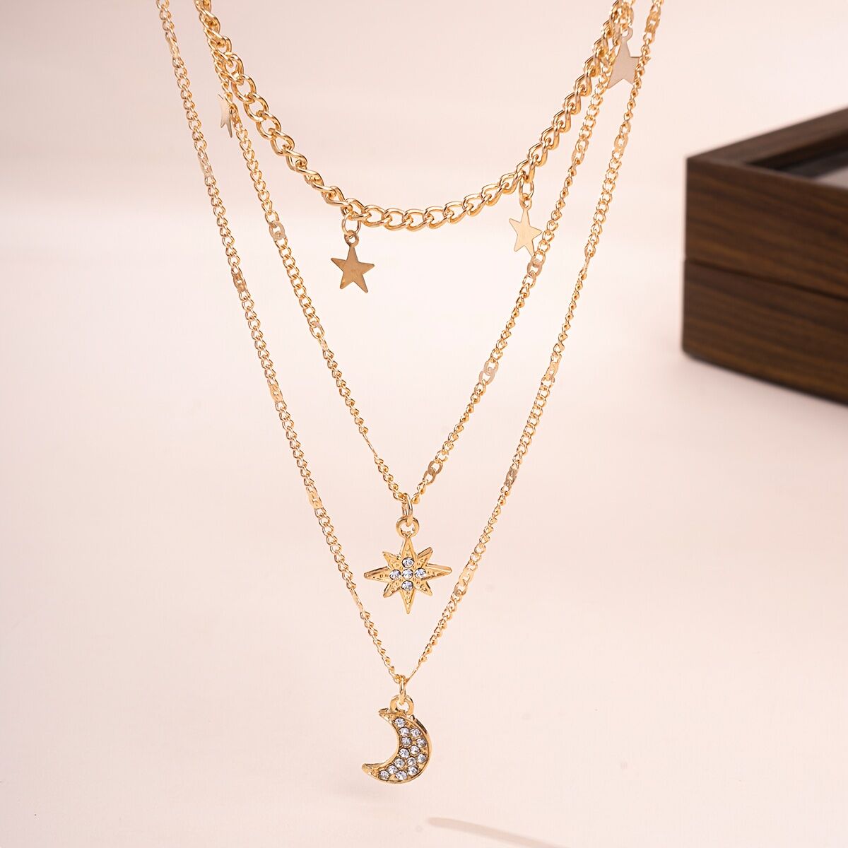 An elegant star, crescent, and sparkle rhinestone-embedded collarbone necklace, a multi-layer pendant necklace for women, perfect for daily wear and a versatile gift.