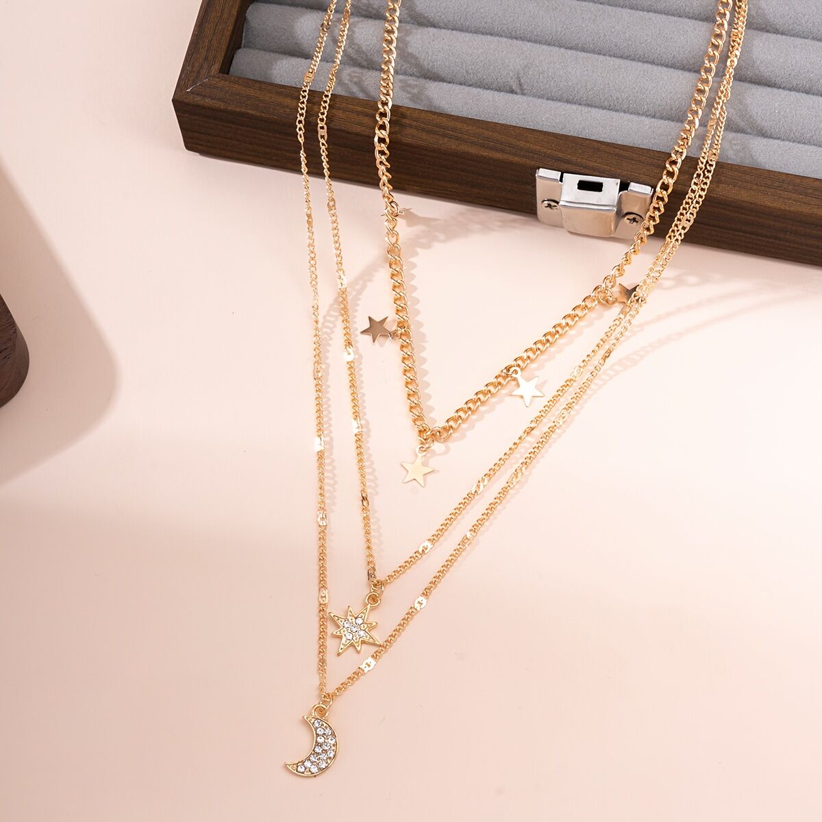 An elegant star, crescent, and sparkle rhinestone-embedded collarbone necklace, a multi-layer pendant necklace for women, perfect for daily wear and a versatile gift.