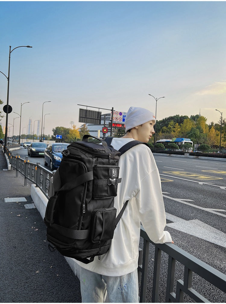 Black Unisex Travel Bag with Utility Buckles and Wet/Dry Compartments