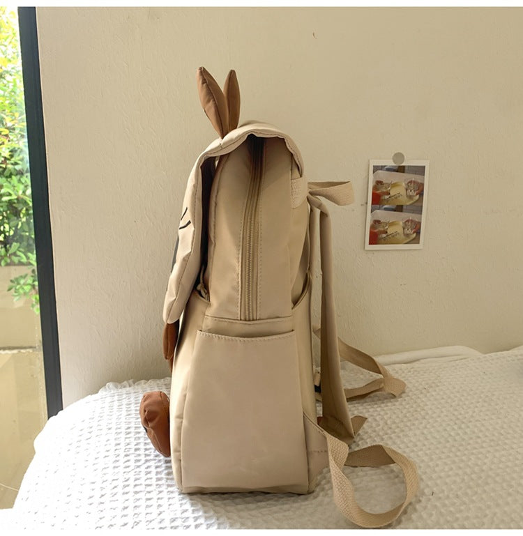 White Lightweight Nylon Waterproof Schoolbag for Children - Large Capacity Daypack with Ugly-Cute Cat Design