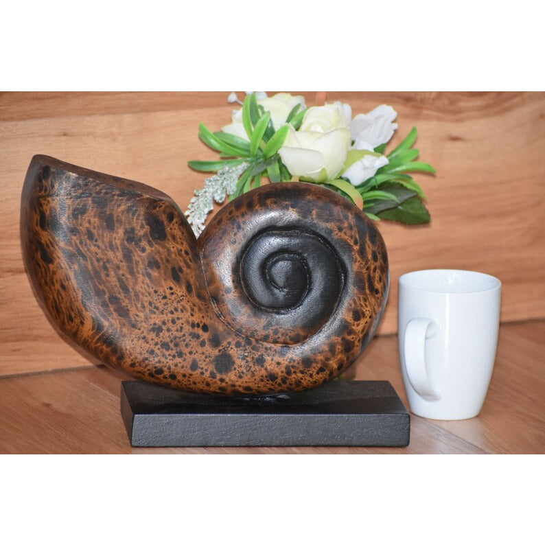 Decorative hand carved wooden shell on stand