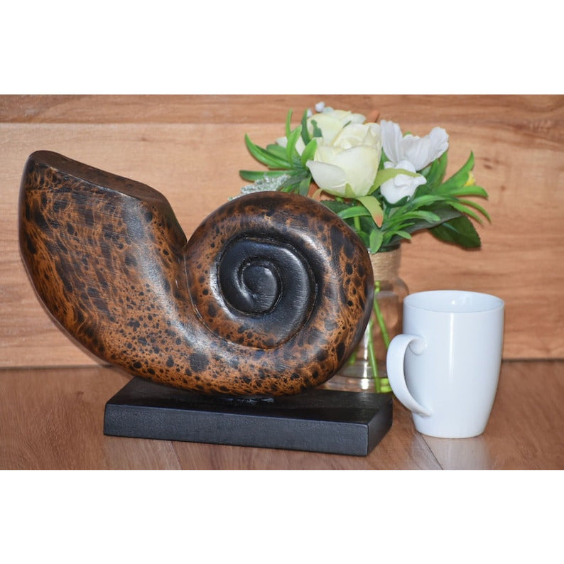 Decorative hand carved wooden shell on stand