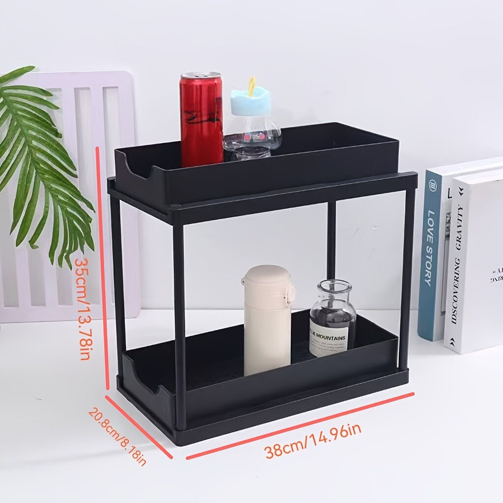 Two-tier pull-out storage rack. An organizational lifesaver for under the kitchen sink. Features adjustable shelves for easy storage of bottles and jars. In a sleek, modern design. Perfect as a kitchen shelf, bathroom organizer, or household storage solut