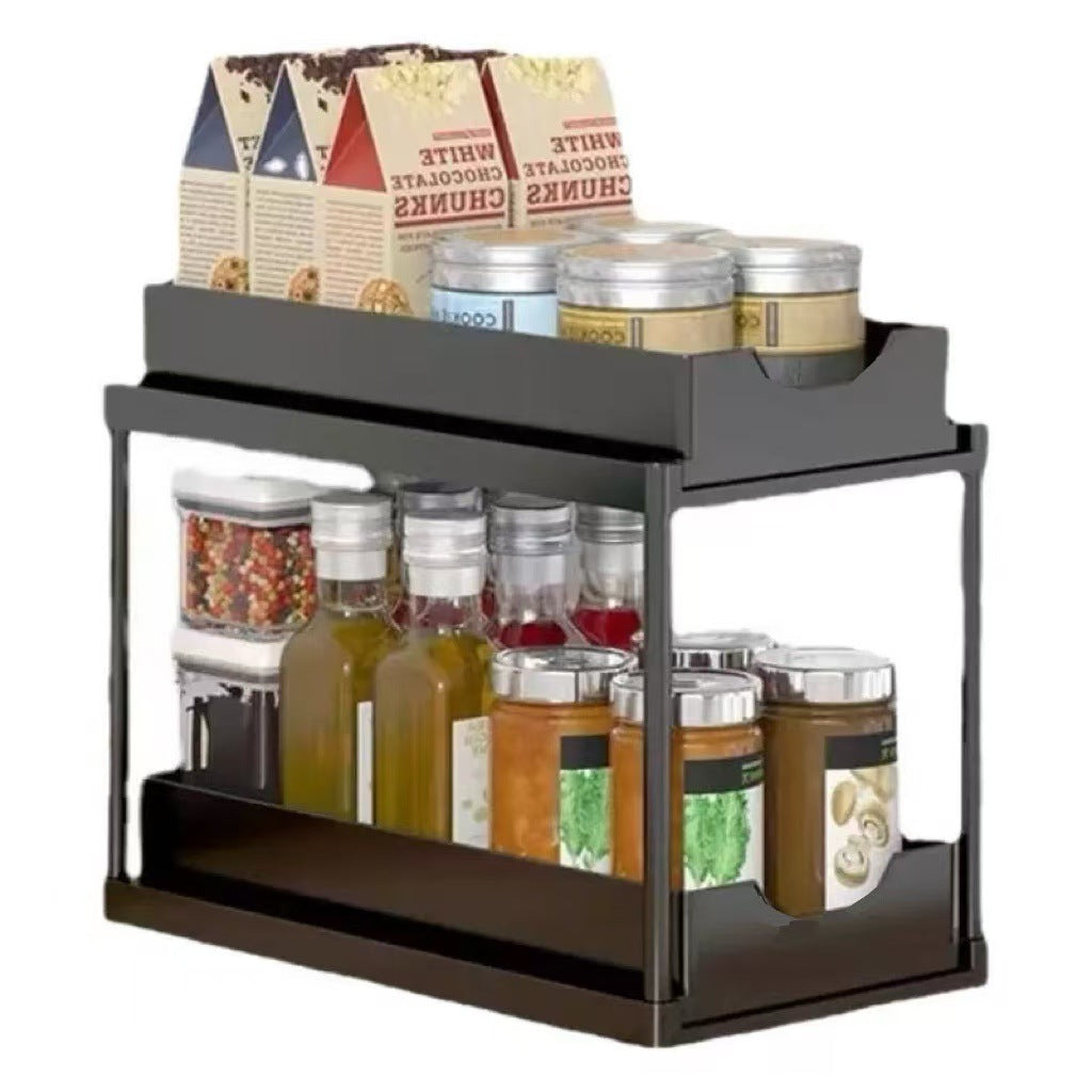 Two-tier pull-out storage rack. An organizational lifesaver for under the kitchen sink. Features adjustable shelves for easy storage of bottles and jars. In a sleek, modern design. Perfect as a kitchen shelf, bathroom organizer, or household storage solut