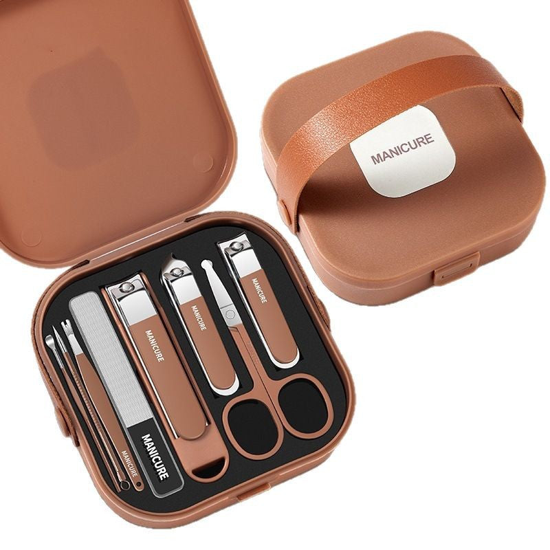 Manicure set - Pedicure set - Nail clippers - Nail scissors - Nail file - Tweezers - Stainless steel - Luxury case - Travel size - Nail cutting - Cuticle pusher - Nail styling - Hands and feet - Compact - Beige - 7 pieces