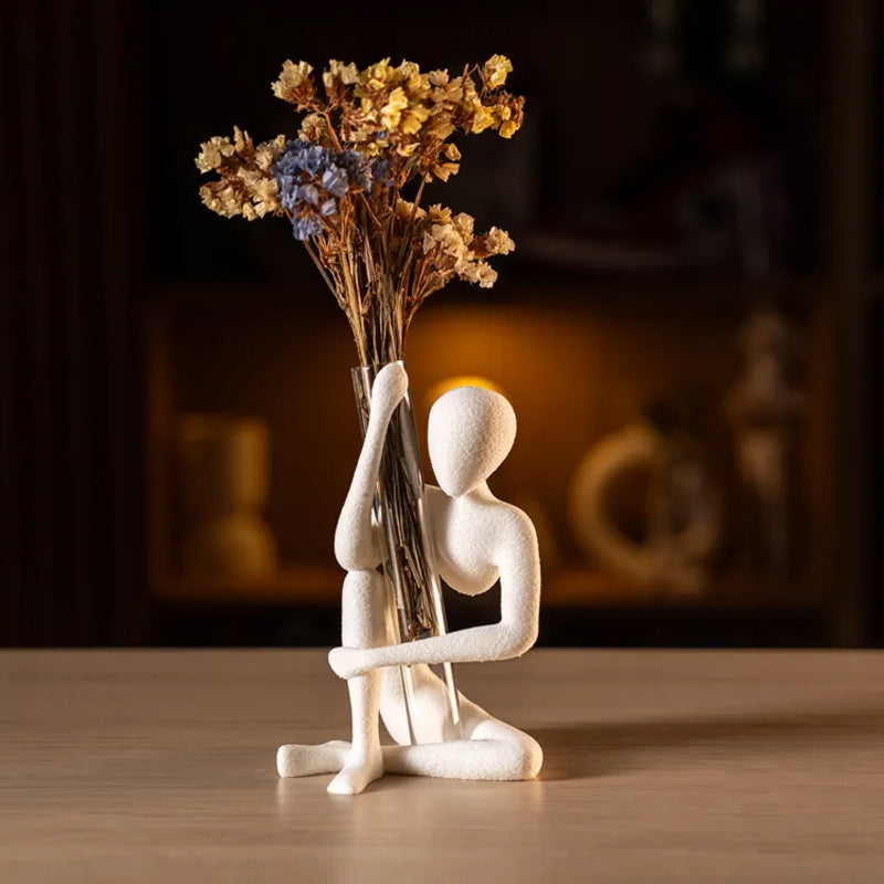 This "Blooming" vase stand adds a touch of nature to your space. White, single piece.