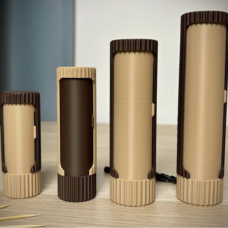 3D-printed compact rotating organizer capsule, 1.3 inches long x 5.9 inches high.