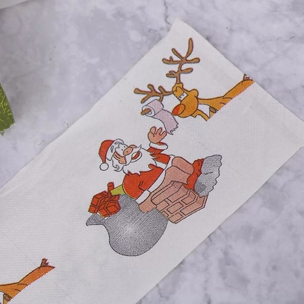 rolls of Christmas themed toilet paper for home, office or restroom