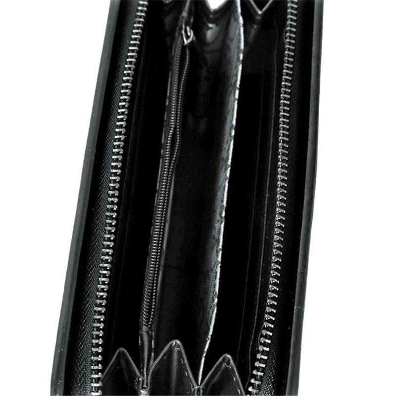 Leather Wristlet Handbag with Metal Skull Design