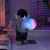Holding the dreamy starry sky (grey top + navy blue pants) Creative Astronaut Bluetooth Speaker with 3D Starry Sky Lighting, Portable Wireless Moon Lamp Speaker – Perfect Gift for Space Enthusiasts