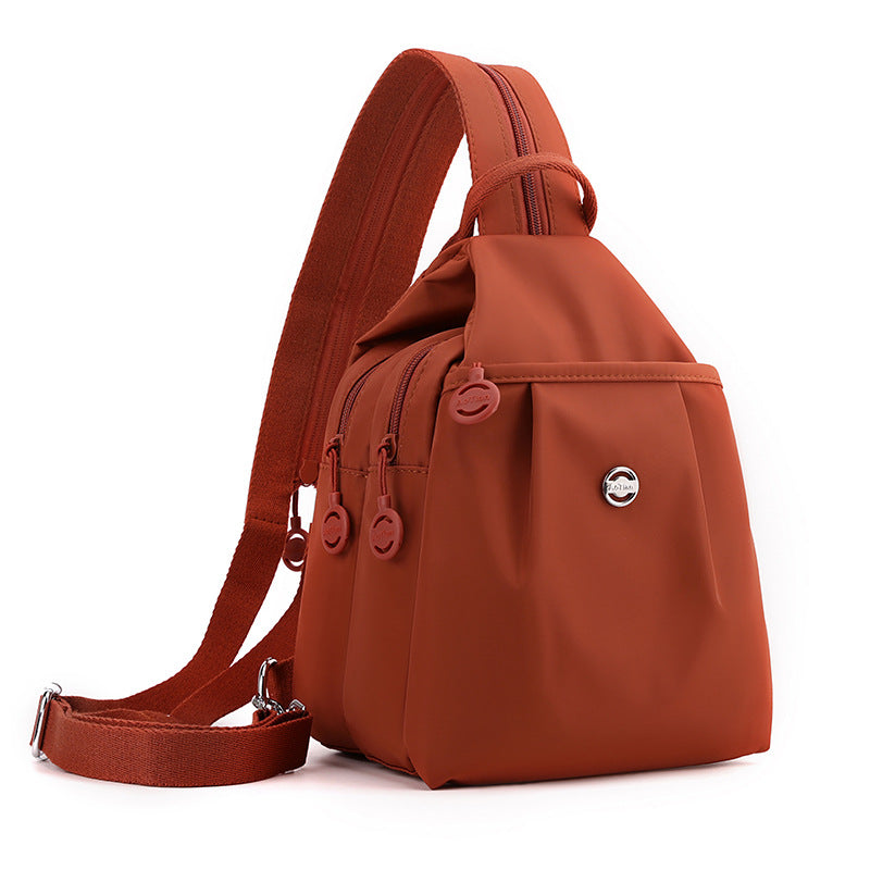 Orange Versatile Women's Convertible Mini Backpack & Sling Bag - Stylish Anti-Theft Oxford Cloth Daypack, Fits 9.7in iPad