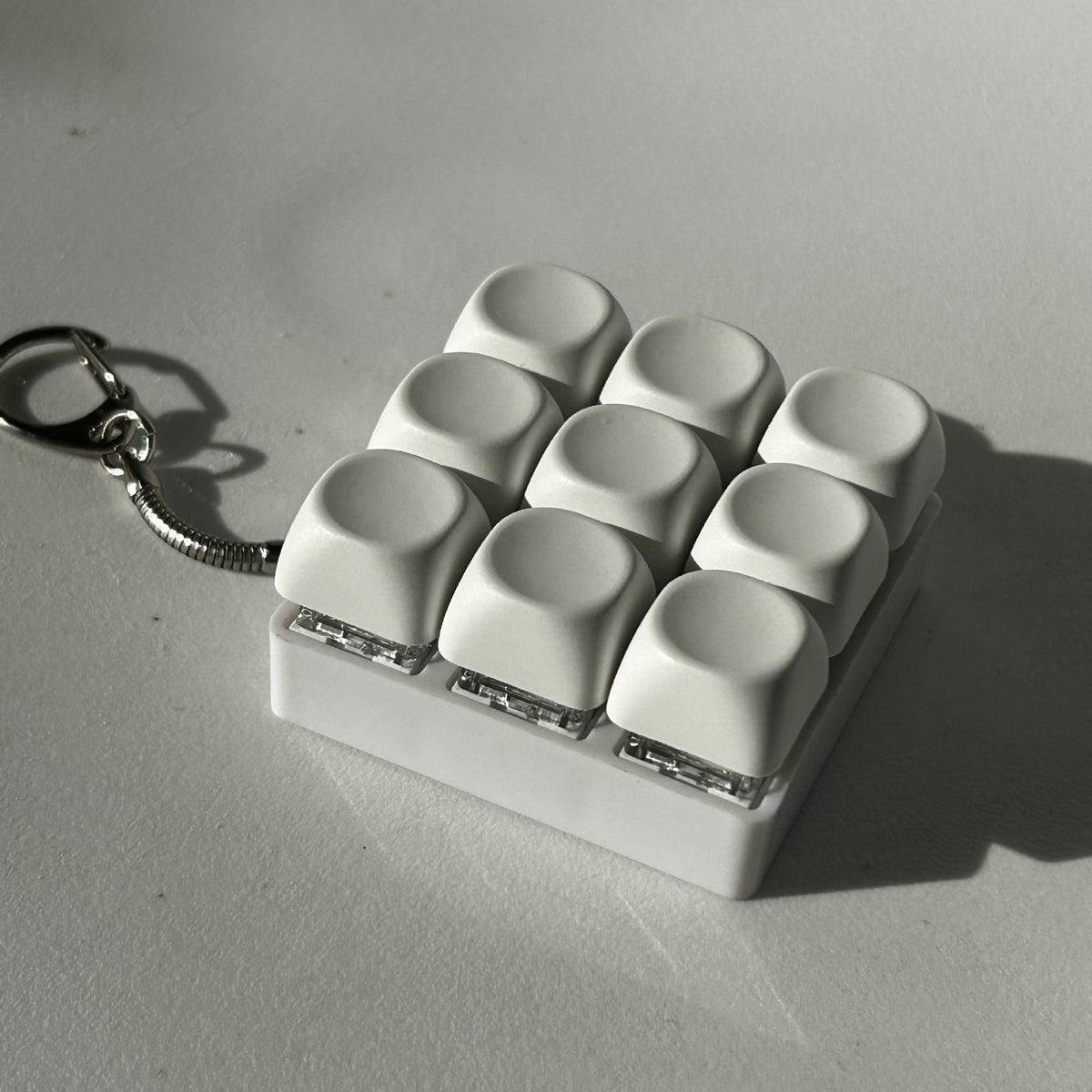 2-Pack White Mechanical 9-Keyboard Fingertip Toy Keychain - Key Pressure Relief, PVC Fingertip Toy