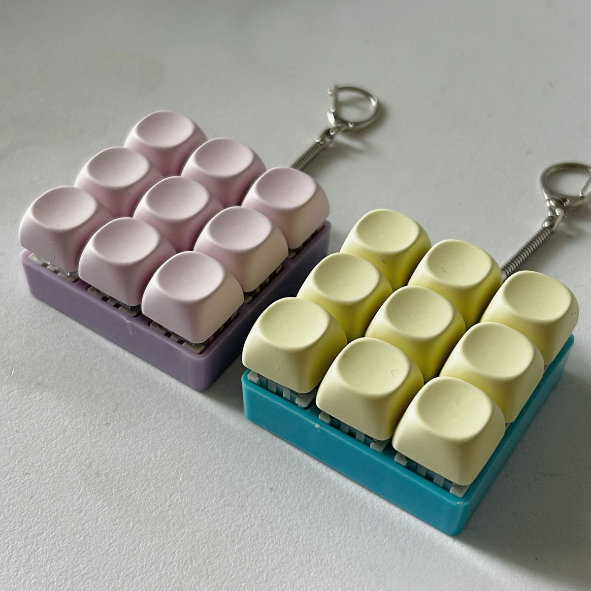 2-Pack White Mechanical 9-Keyboard Fingertip Toy Keychain - Key Pressure Relief, PVC Fingertip Toy