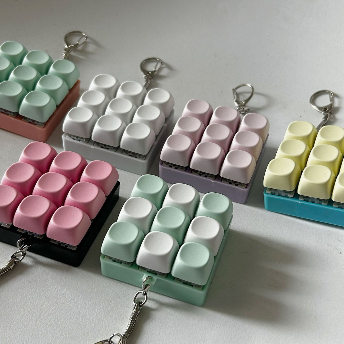 2-Pack White Mechanical 9-Keyboard Fingertip Toy Keychain - Key Pressure Relief, PVC Fingertip Toy