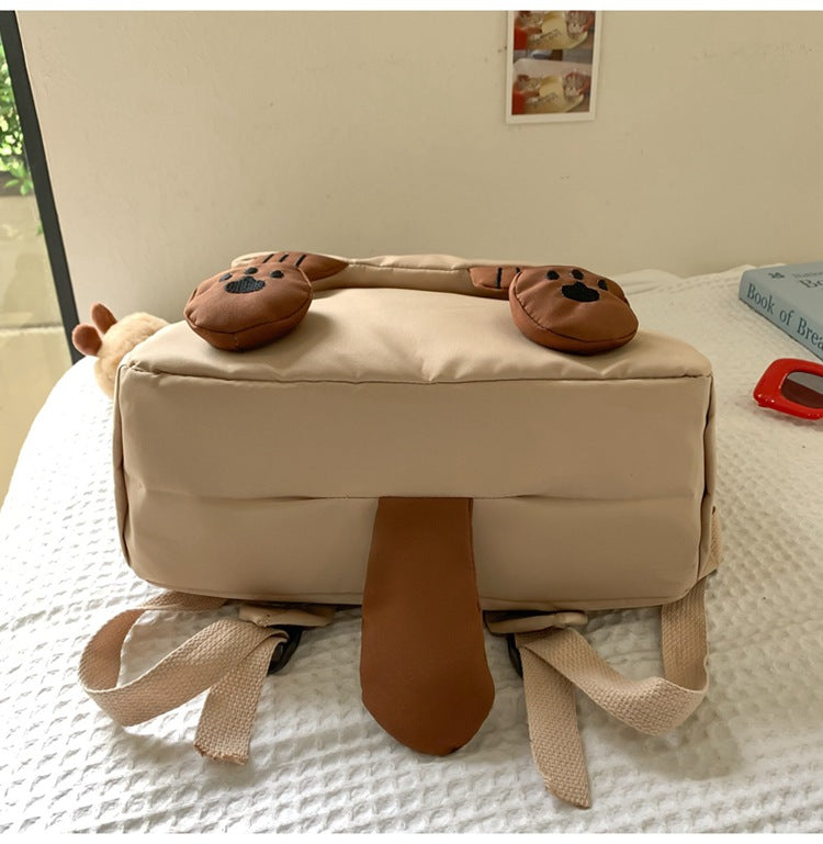 White Lightweight Nylon Waterproof Schoolbag for Children - Large Capacity Daypack with Ugly-Cute Cat Design